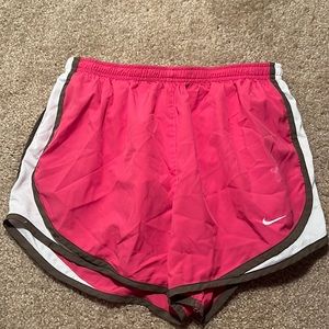 Pink NIKE running shorts